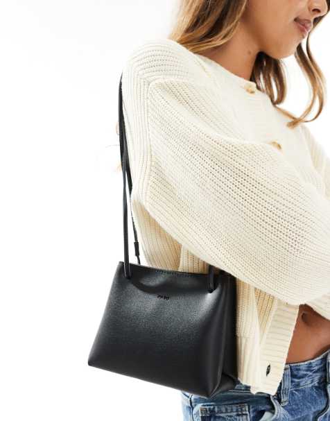PASQ box bag with adjustable crossbody strap in black - view 1