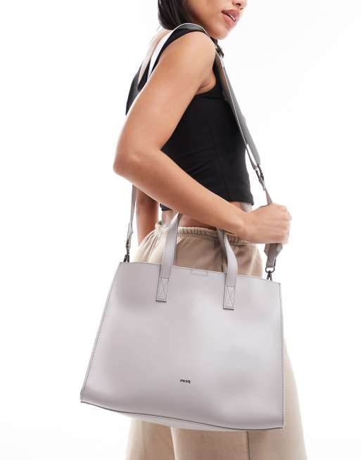 PASQ - Bred grå tote-taske med struktur og aftagelig crossbody-rem