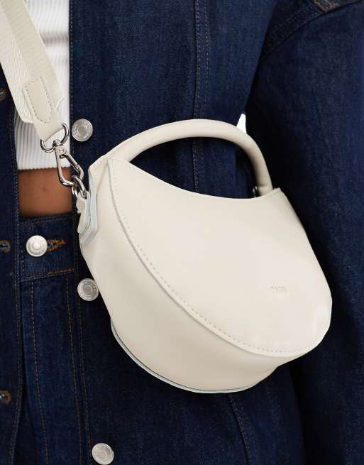 PASQ circle grab bag with crossbody strap in off-white