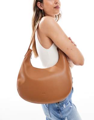 PASQ curved slouch shoulder bag in tan - view 1