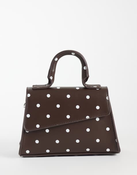 PASQ diagonal flap grab bag with crossbody strap in brown polkadot - view 1