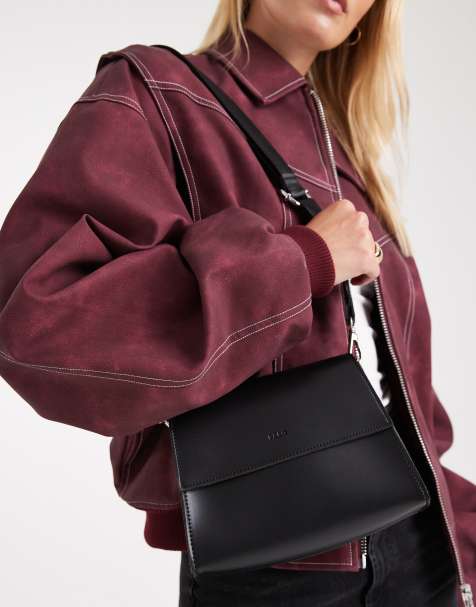 PASQ flapover classic crossbody bag in black - view 1