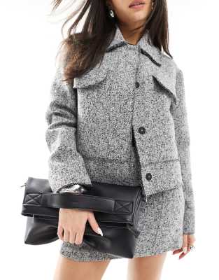 fold-over clutch bag with crossbody strap in black
