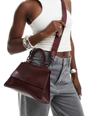 mini curved bottom grab bag with cross body strap in burgundy-Red