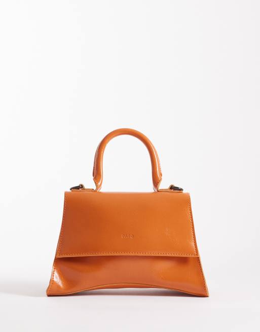 PASQ – Orange, liten axelremsväska med rundad botten och handtag