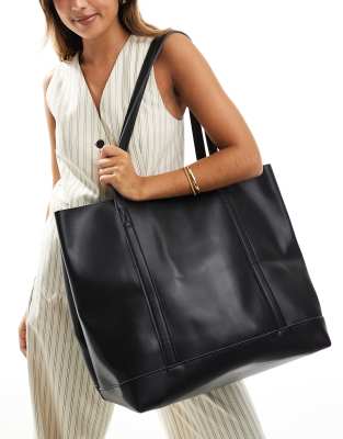 oversized slouch tote bag with front pocket and inside pouch in black