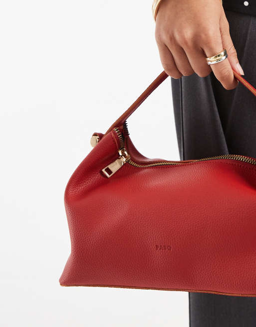 PASQ soft zip top grab bag with crossbody strap in red | ASOS