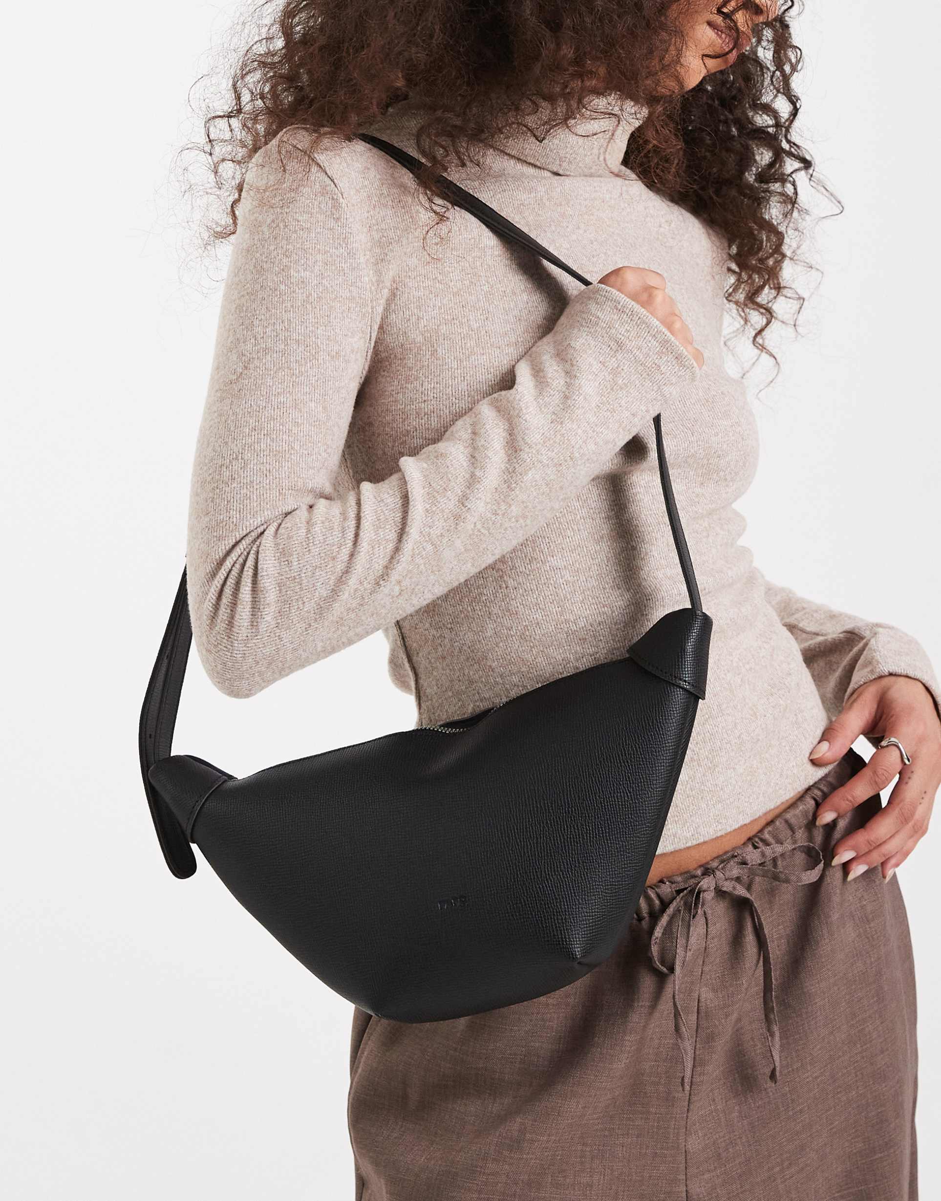 pasq textured croissant crossbody bag in black