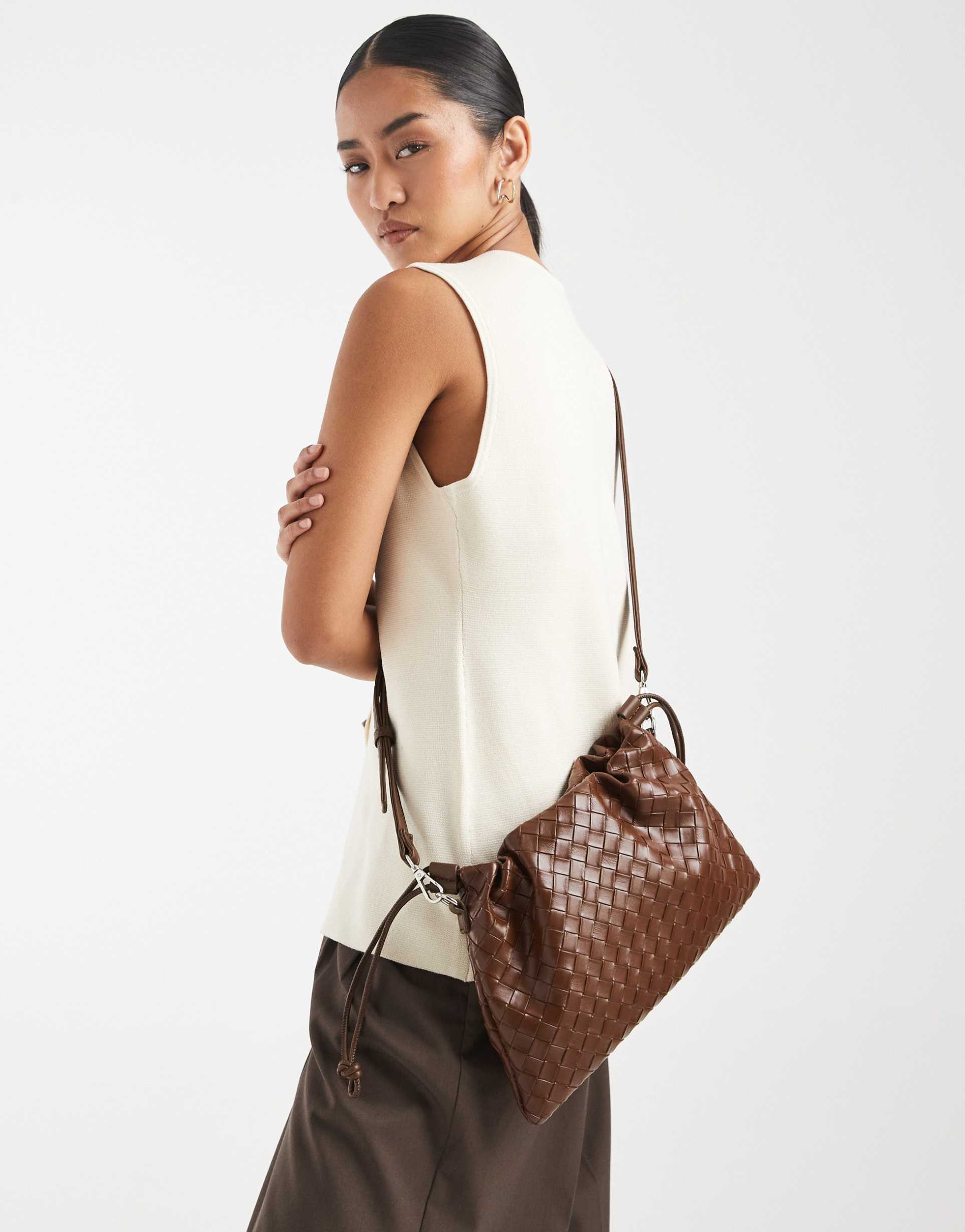 pasq woven drawstring crossbody bag in dark brown