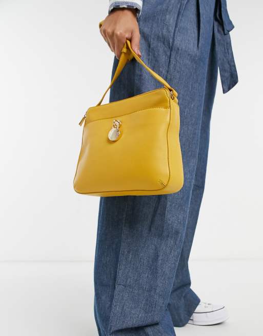 Paul Costelloe leather cross body bag with gold hardware in yellow ASOS
