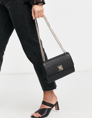 black shoulder bag with gold chain