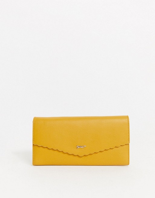 Paul Costelloe real leather mustard foldover purse with scallop edge