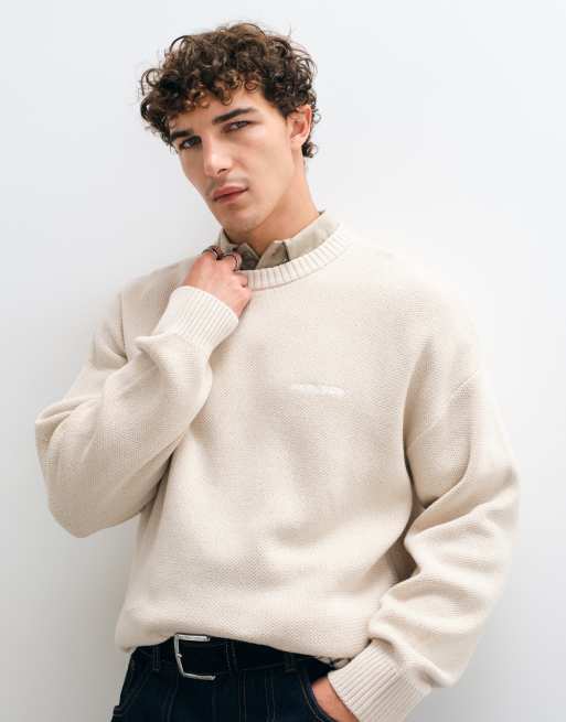 Pegador jersey de punto extragrande con logo en color crema, 1 de 5