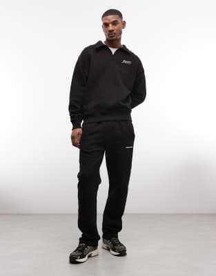 Jogginghose in verwaschenem Schwarz mit weitem Bein und Logo Schwarz L