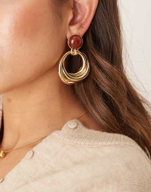 Pendientes de aro dorados con diseño colgante de Mango 