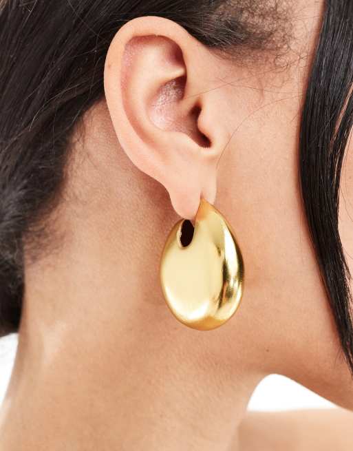 Pendientes de aro dorados con diseño grueso de Mango 