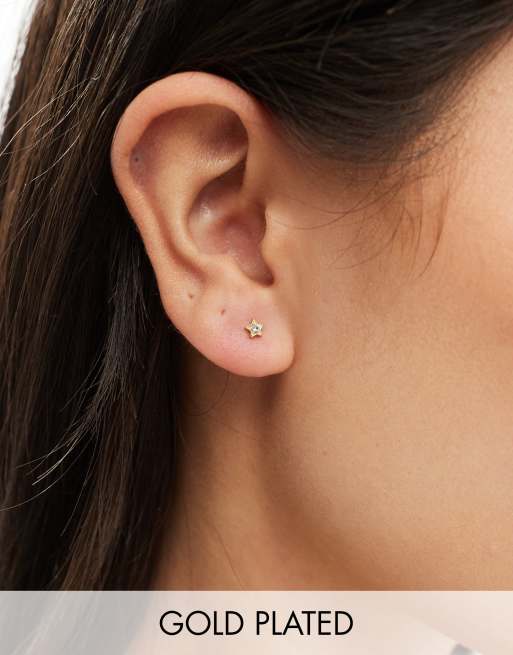 Pendientes de botón dorados con diseño de estrella con cristal chapados en oro de Kingsley Ryan