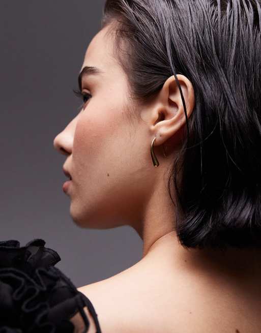 Pendientes dorados con diseño colgante de acero inoxidable resistente al agua Padme de Topshop