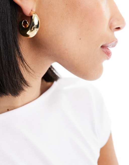 Pendientes dorados con diseño de medio aro de Mango