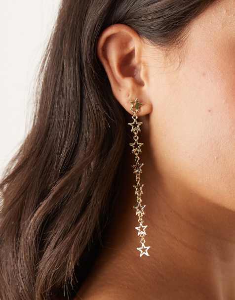Pendientes largos dorados con diseño de estrellas de DesignB London - view 1