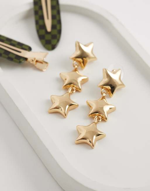 Pendientes largos dorados con diseño de estrellas de DesignB London, 2 de 4