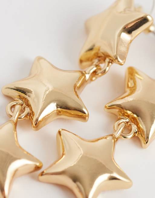Pendientes largos dorados con diseño de estrellas de DesignB London, 3 de 4