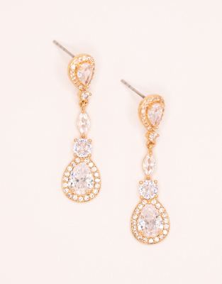 Pendientes largos dorados con diseño tipo halo de circonitas de Lovisa 