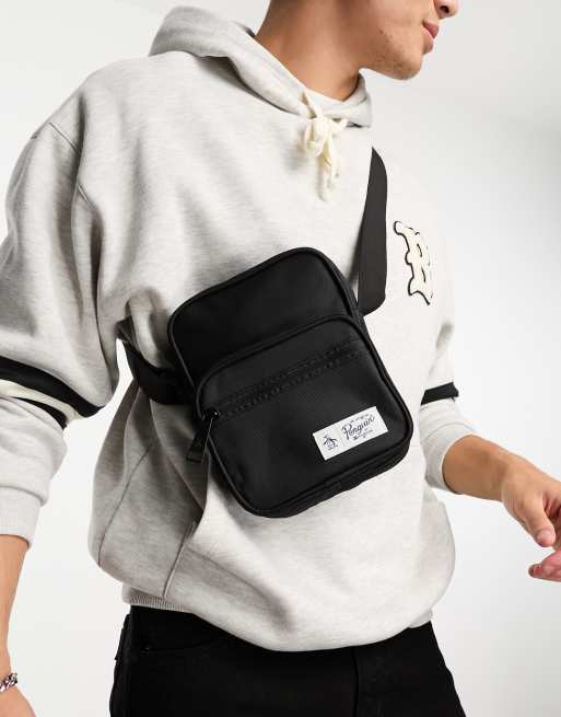 Penguin logo cross body bag in black | ASOS