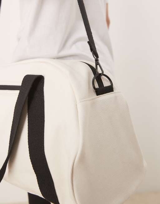 Petate de viaje negro y color crudo de lona de ASOS DESIGN, 3 de 4