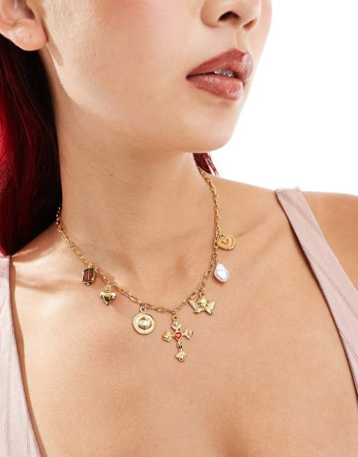 Petit Moments - Collana color oro con charm a croce