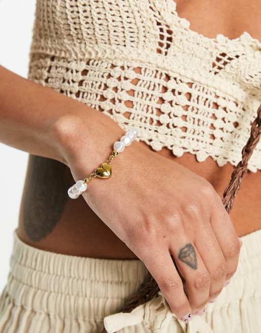Petit Moments faux pearl bracelet with heart pendant 