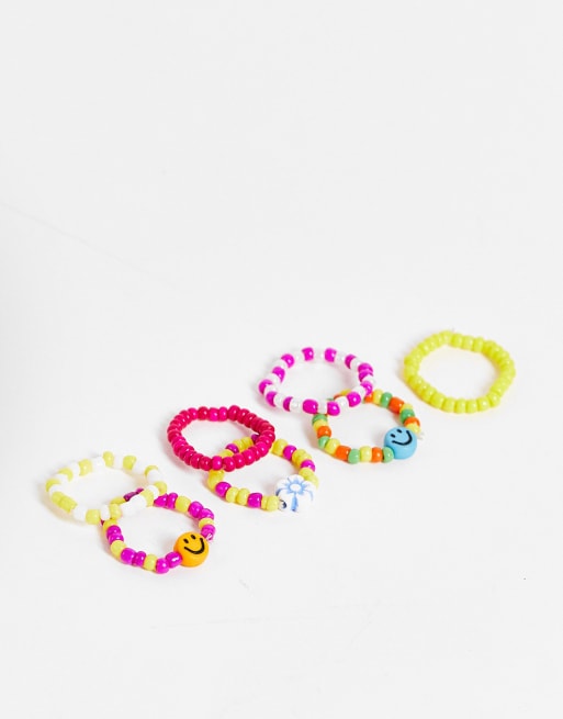 Pieces 7 pack beaded rings with faces in multicolour