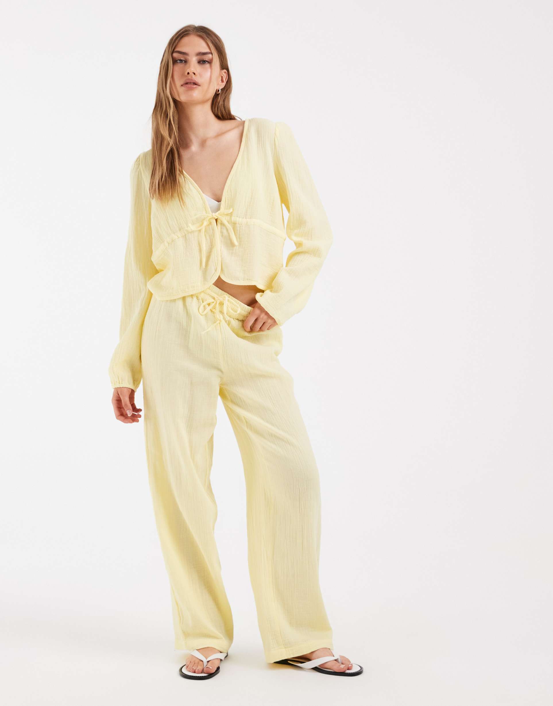 pieces crinkled cotton wide leg pants in pastel yellow - part of a set