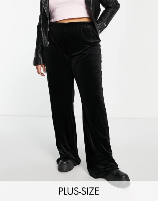 Pieces Curve high waisted velvet flared trousers in black