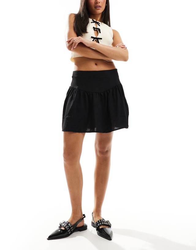 Pieces - dipped yoke ruched mini skirt in black