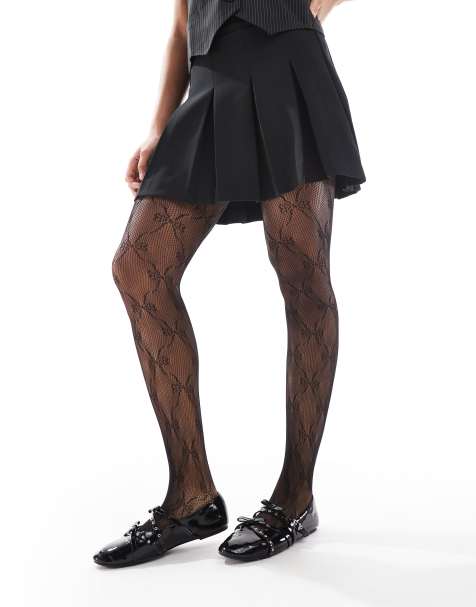 Pieces fishnet bow tights in black - view 1