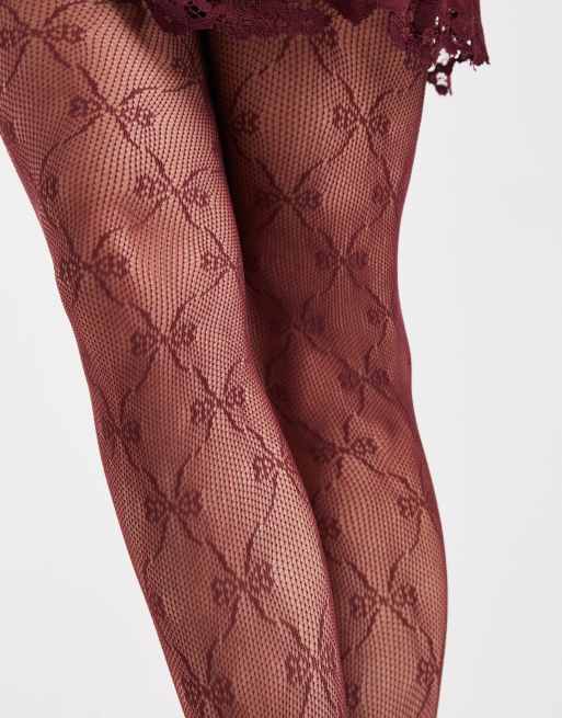 Pieces fishnet bow tights in burgundy