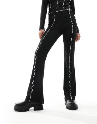 flared ribbed pants with contrast stitch in black - part of a set