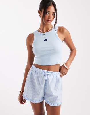 flower embroidered cropped tank top in light blue