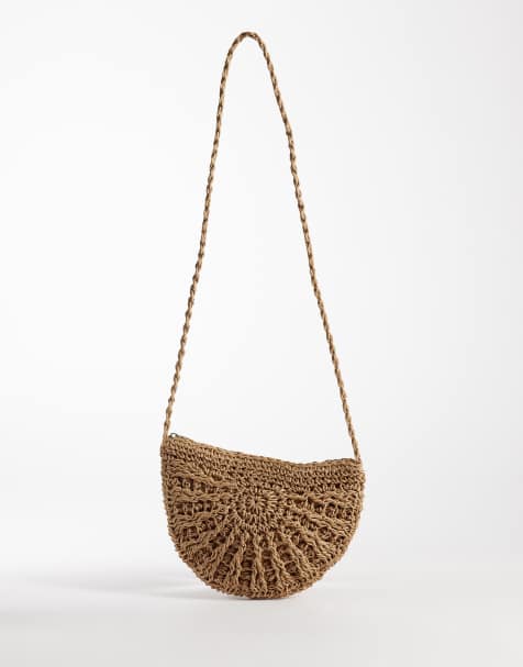 Pieces half moon crossbody bag in natural straw - view 1