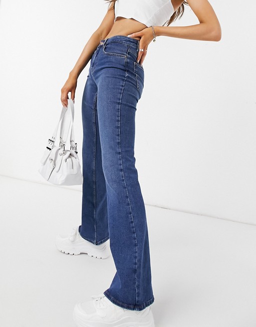 Pieces Peggy mid waist flare jeans in mid blue wash