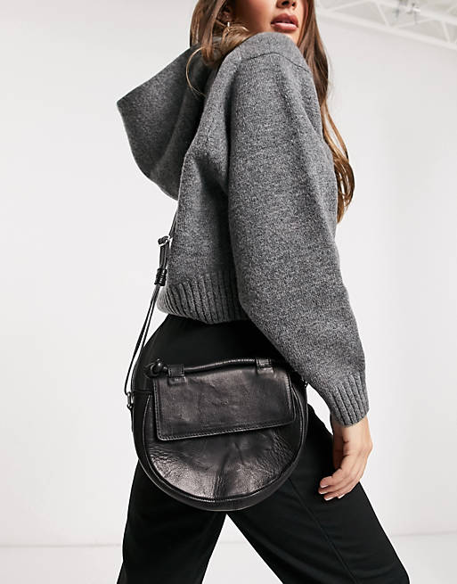 Pieces leather curved cross body bag in black | ASOS