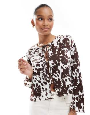 long sleeve tie front top in cow print-Multi