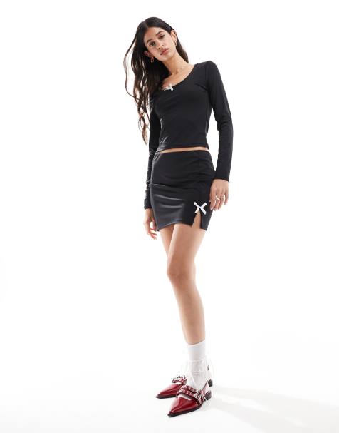 Pieces Mix & Match slinky mini skirt co-ord with pink bow front in black - view 1