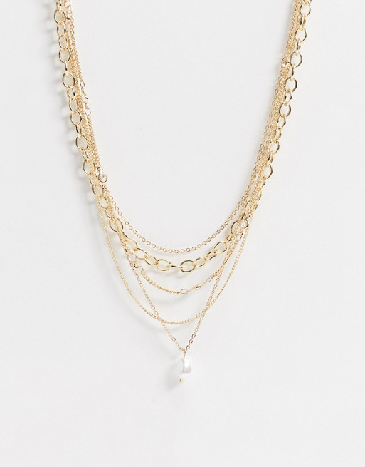 Pieces multi chain necklace with crystal and pearl drop in gold