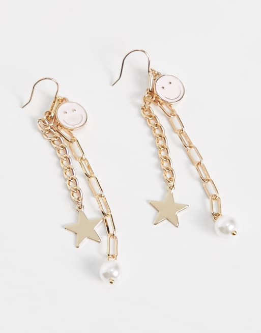 PIECES - Orecchini color oro con catenina pendente con smile e stella