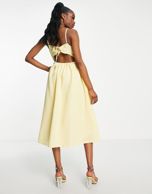 Pieces Premium textured open back midi dress in pale yellow | ASOS