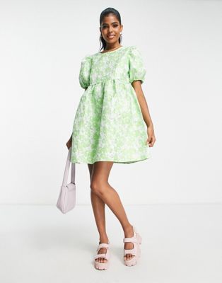 Pieces Premium textured puff sleeve tie back mini dress in green floral