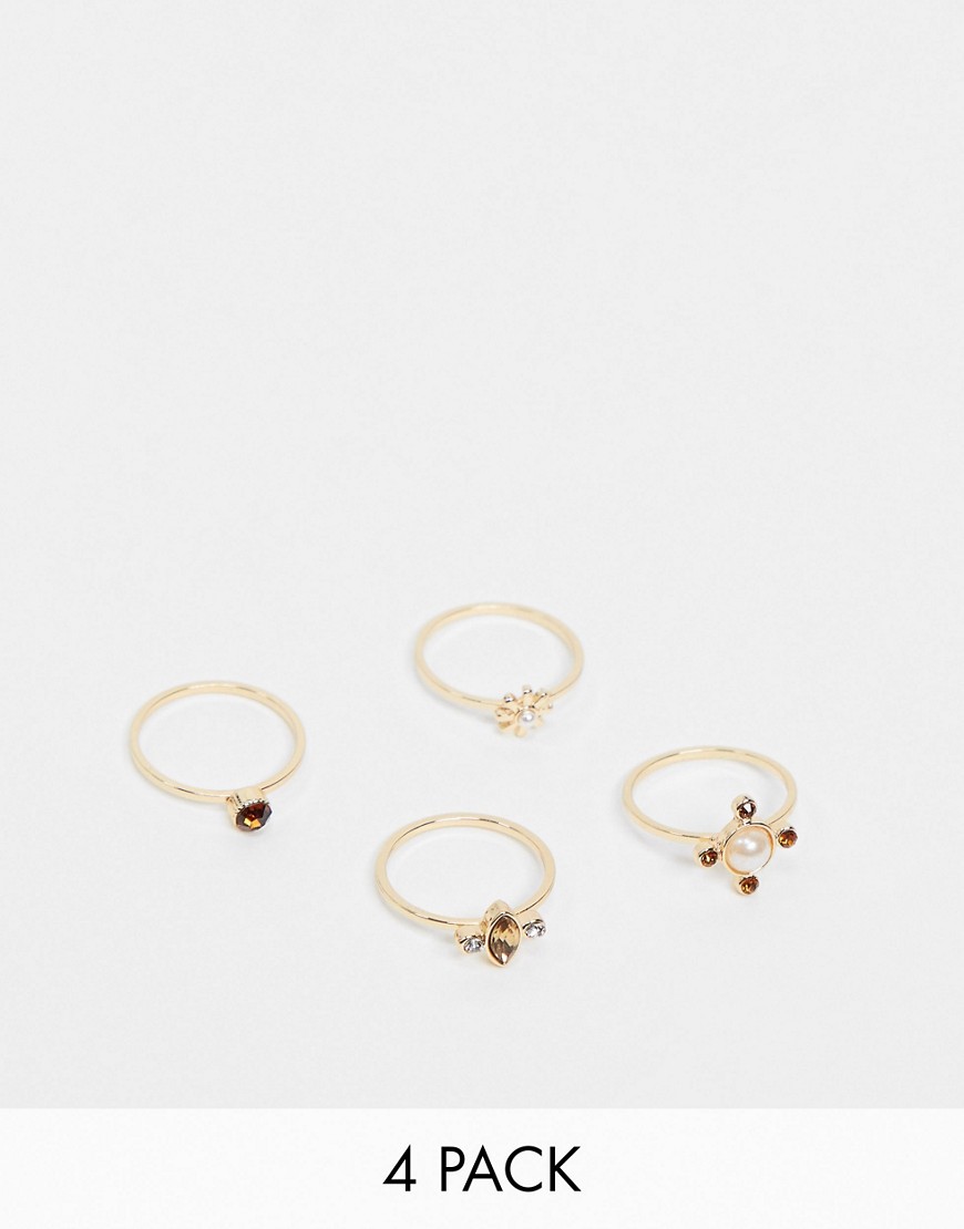 Pieces - Set van 4 goudkleurige ringen met siersteentjes