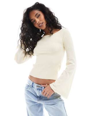 structured rib knit top with flared sleeves in cream-White